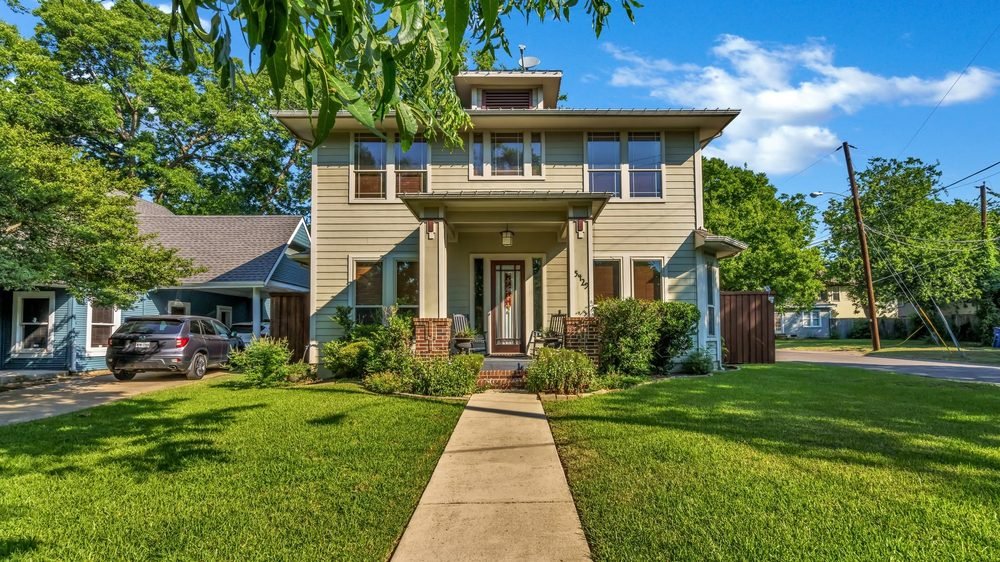 Two-story East Dallas area home exterior with front walk